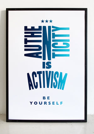 Framed print that says authenticity is activism in blue.