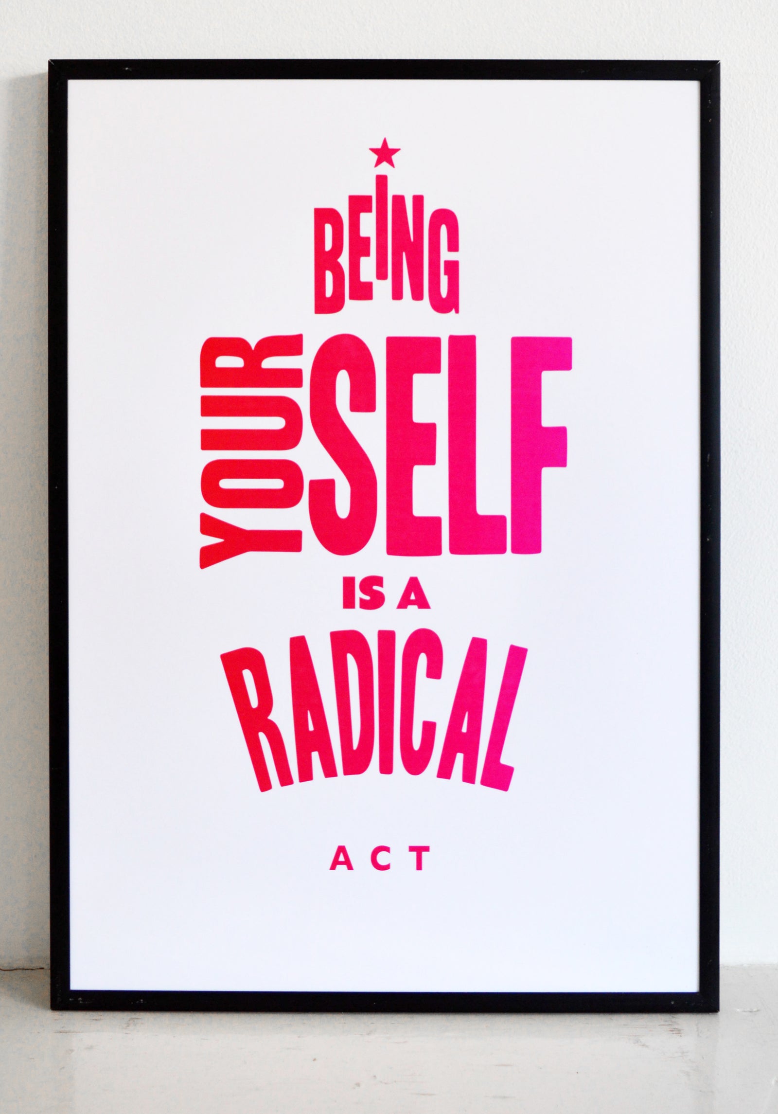 poster that says being yourself is a radical act in blue ink.